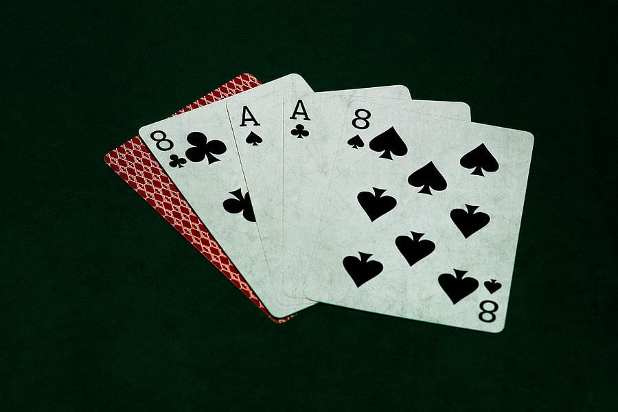 Playing Cards On Dark Green Table Felt