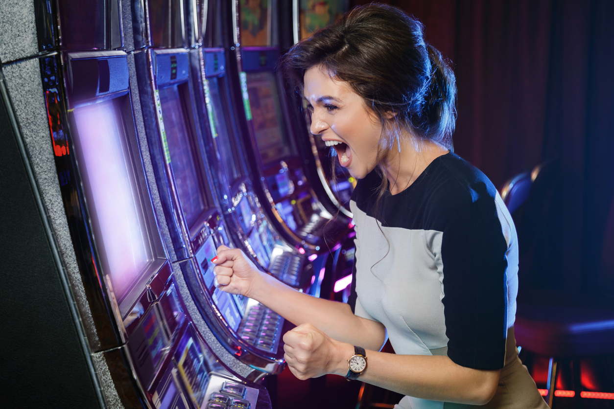 Woman is happy of her win in slot machines