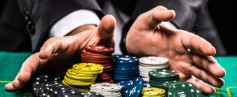 table game player collecting huge amount of chips